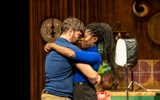 Faith Omole and James Corrigan embrace