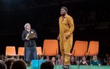 Felicity Montagu holds a clipboard while Hammed Animashaun stands there looking shocked