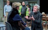 Alex Jennings kneels in front of Hermione Gulliford with a pleading looks on his face.