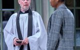 Alex Jennings and Racheal Ofori stand, he watches her as she ignores him.